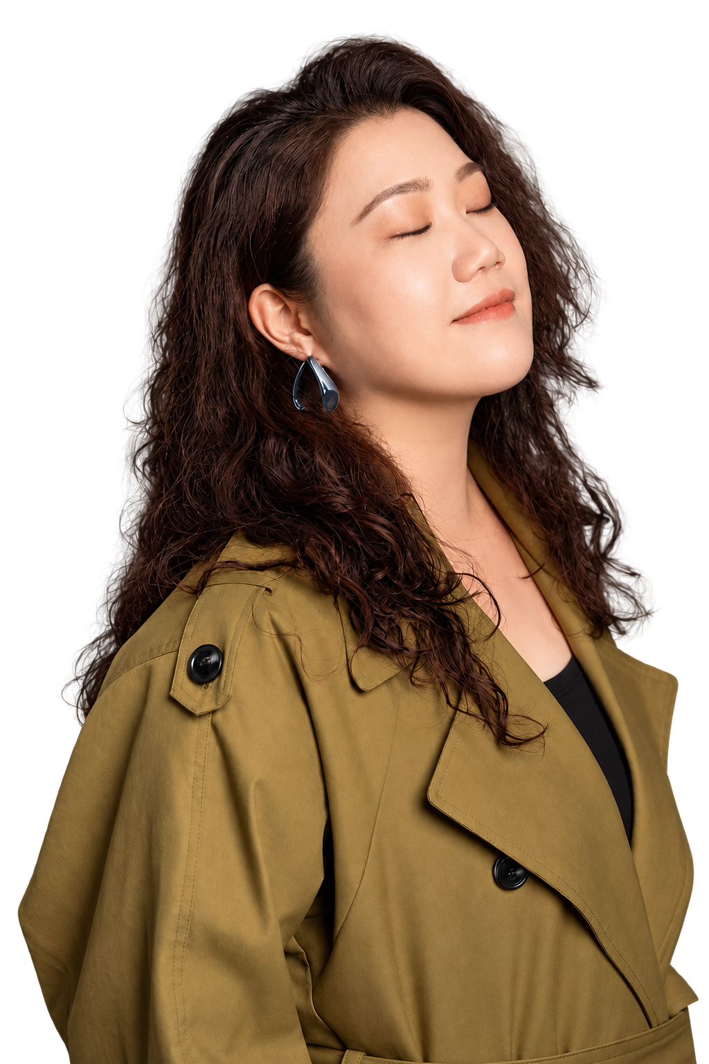 Ang Mei Foong in an olive coat with eyes closed